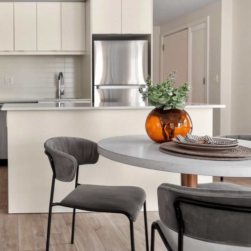 Staged dining room and kitchen at The Towns at York Mills & Leslie.